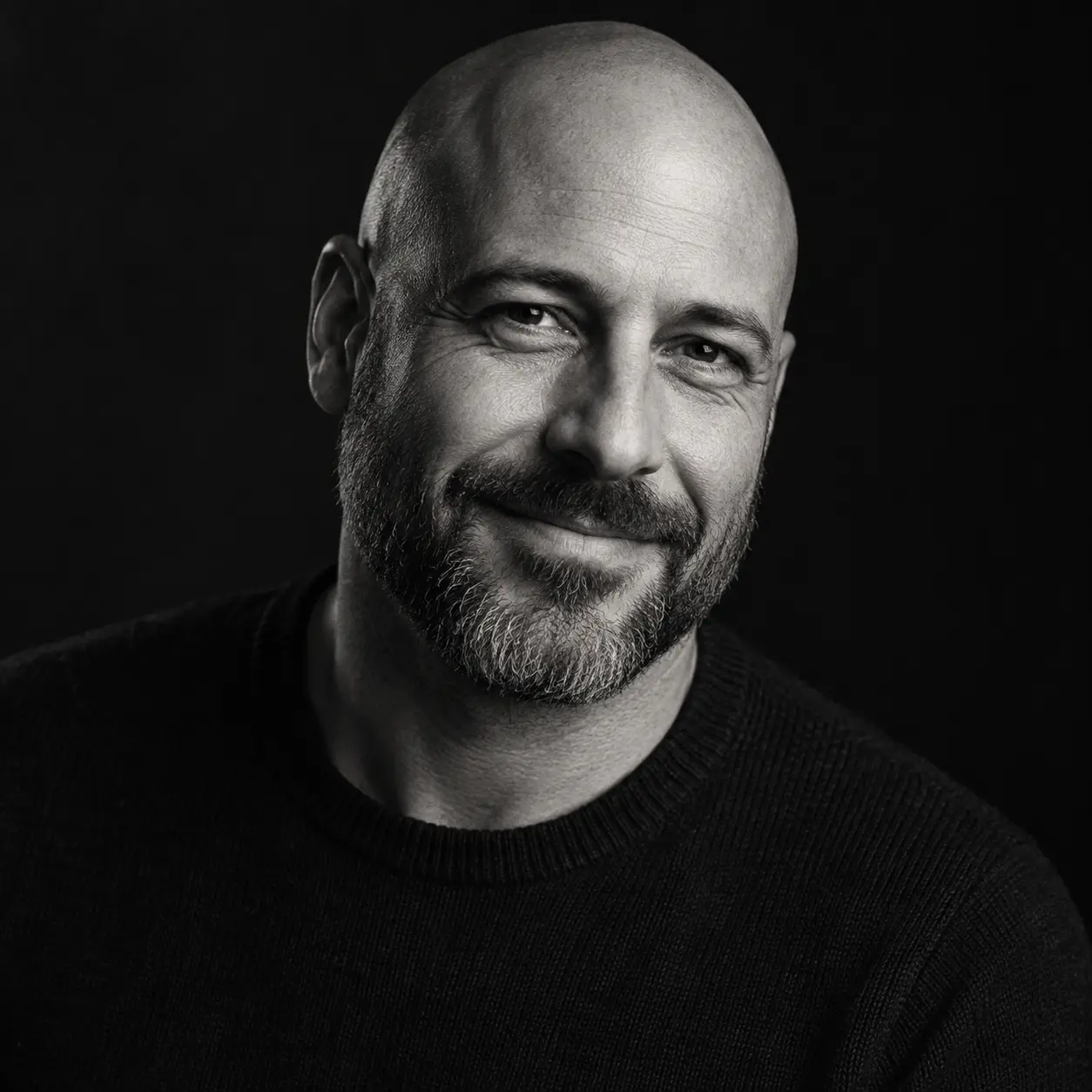 Black and white side-lit portrait of a man